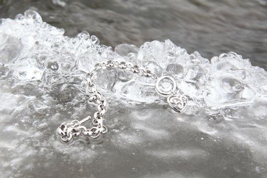 Layer of ice with a heart shaped bracelet charm