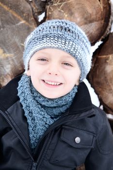 Young boy playing outside on a snowy day
