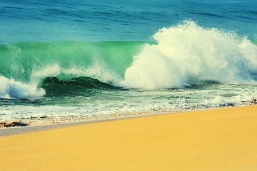 Wave of the ocean on the sand beach
