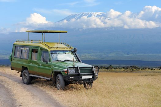 Safari game drive on Kilimanjaro moun background. Kenya, Africa