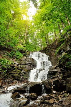 Waterfall in forest. In the deep forest on mountain