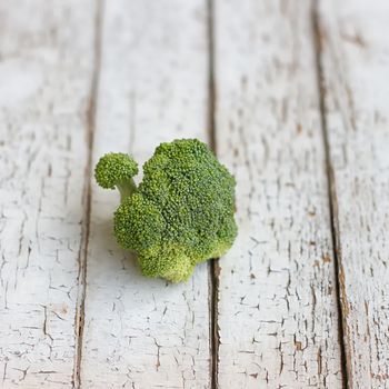 Fresh raw broccoli .on a wooden table. Selective Focus