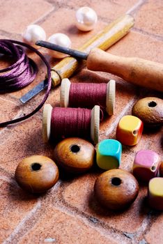 Wooden jewelry beads and tools for needlework at home