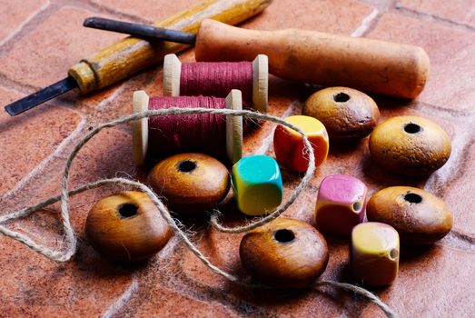 Wooden jewelry beads and tools for needlework at home