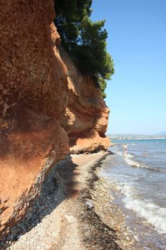 Red rocks on the coast of Aegean Sea close to Nikiti,Greece