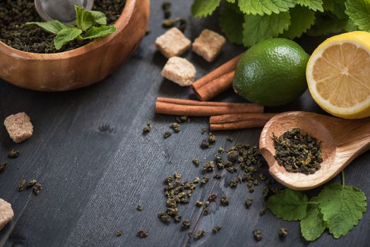 tea composition with cinnamon sticks, lemons