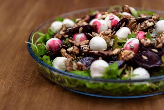 arugula salad with beet quail eggs and nuts