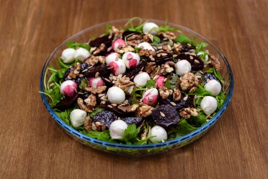 arugula salad with beet quail eggs and nuts