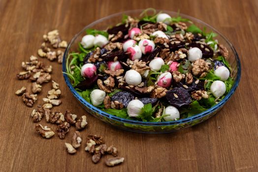 arugula salad with beet quail eggs and nuts