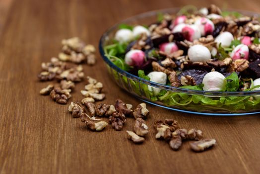 arugula salad with beet quail eggs and nuts