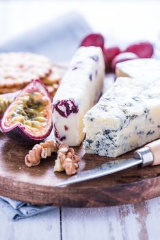 Cheese selection with fresh fig and grapes