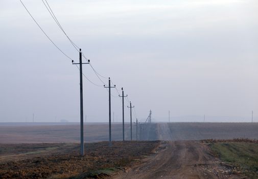 photographed close-up, high-voltage electric poles located in the countryside