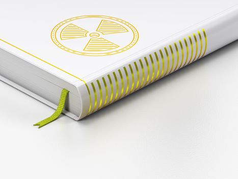 Science concept: closed book with Gold Radiation icon on floor, white background, 3D rendering