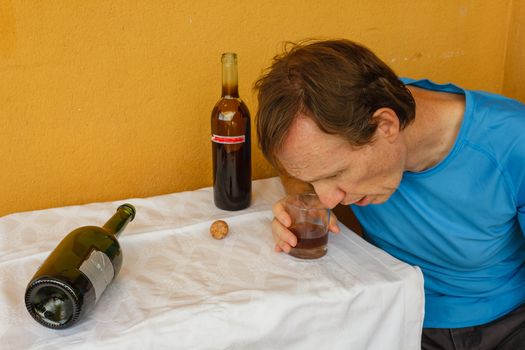 a man swept two bottles of wine