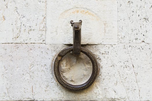 Close-up of an antique ring for tying horses