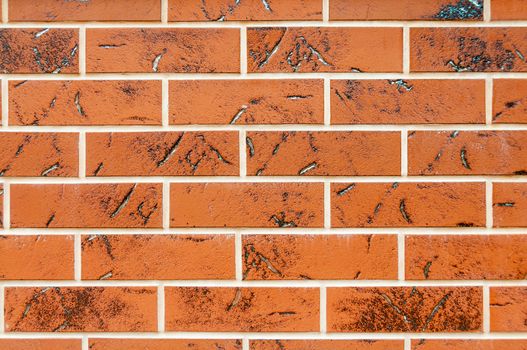 Brown texture tiles under brick background. Wall