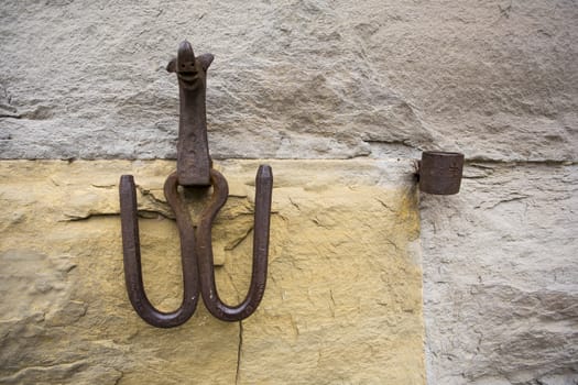 Close-up of an antique ring for tying horses