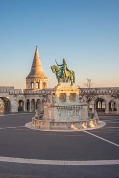 Saint Stefan Statue at Fisherman's Bastion, in Budapest, Hungary with Clear Blue Sky in Background at Sunrise