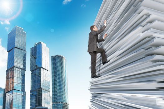 Businessman climbing up a huge stack of white paper with city background