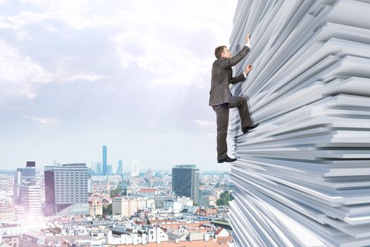 Businessman climbing up a huge stack of paper with city background