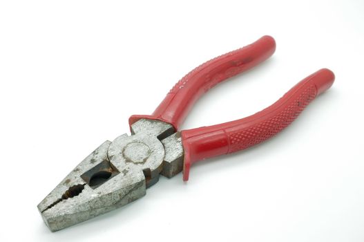 A pair of red pliers isolated on a white background