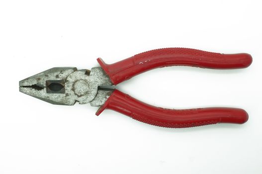 A pair of red pliers isolated on a white background