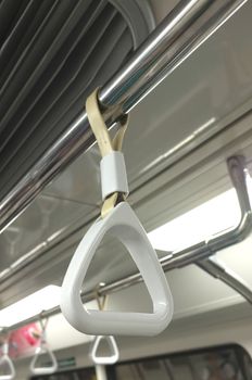 White handrail for passenger handling in train