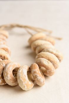 bundle of bagels on a white tablecloth in natural light