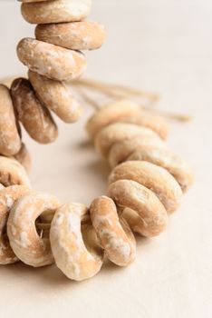 bundle of bagels on a white tablecloth in natural light