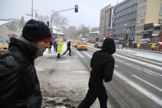 TURKEY, Istanbul : People walk towards a street during snowfall in Istanbul on New Year's Eve, December 31, 2015.Istanbul had a thick covering of snow early today, while almost 30 centimetres (12 inches) fell in some parts of the city, causing disruptions to transport services and the closure of several roads. 