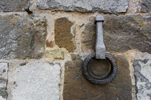 Close-up of an antique ring for tying horses