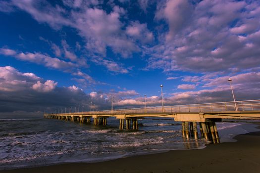 Bottom view of the sea pier in Marina di Massa