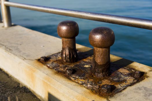 Close up view of two old cleats by salt