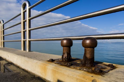 View of two old cleats of a pier marine eroded by salt