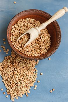 lentils on a wooden table . selective focus