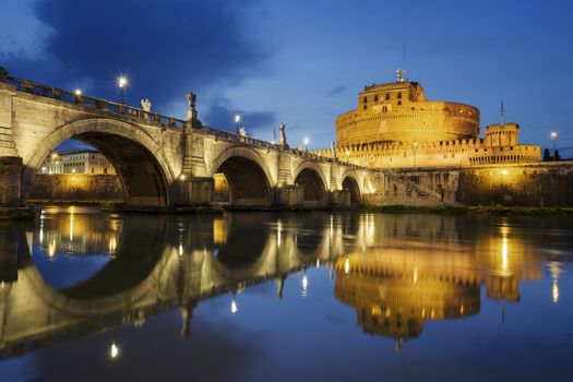 Rome. Image of the Castle of Holy Angel and Holy Angel Bridge over the Tiber River in Rome bynight.