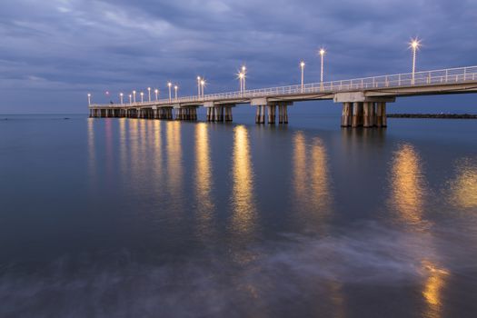 Panoramic view of a pier decorated with Christmas lights