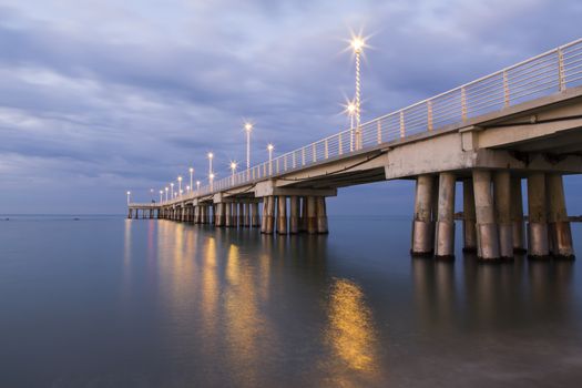 Panoramic view of a pier decorated with Christmas lights