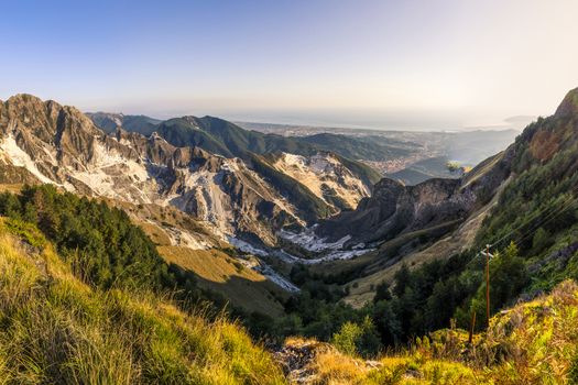 Panoramic views of the marble quarries of Carrara with shoreline in the background