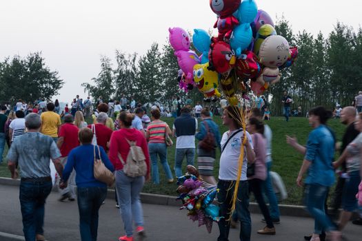 Seller balloons in crowd Russia ,Moscow. iuly 2016