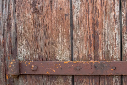 texture of wooden surface with remnants of old paint that has dried and cracked under the influence of weather