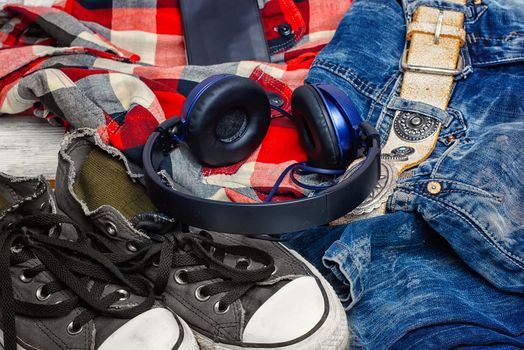 Jeans,shirt, sneakers and phone with headphones for teenagers