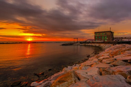 View of the sunset in Marina di Massa using the technique hdr