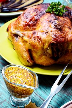 Grainy spicy pepper mustard served with baked chicken