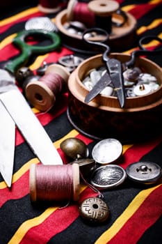 Scissors ,iron, stylish old-fashioned buttons and thread