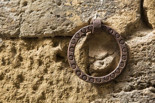Antique ring for tying horses on an ancient wall