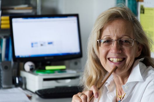 View of business woman working in his office