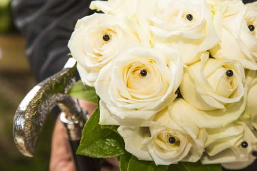 Close-up view of a bridal bouquet made of roses pale yellow