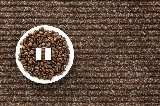 Concept of a coffee pause, coffee beans arranged in a circle with sugar cubes.