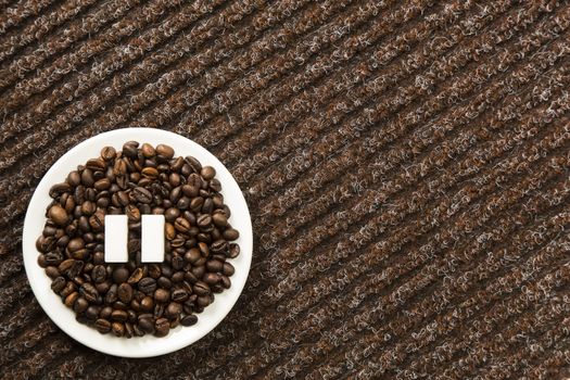 Concept of a coffee pause, coffee beans arranged in a circle with sugar cubes.